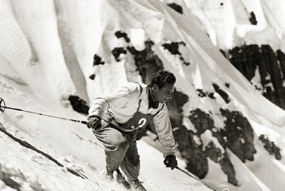 Archival photograph of a downhill racer on a steep Sierra face in the early days of Sugar Bowl.